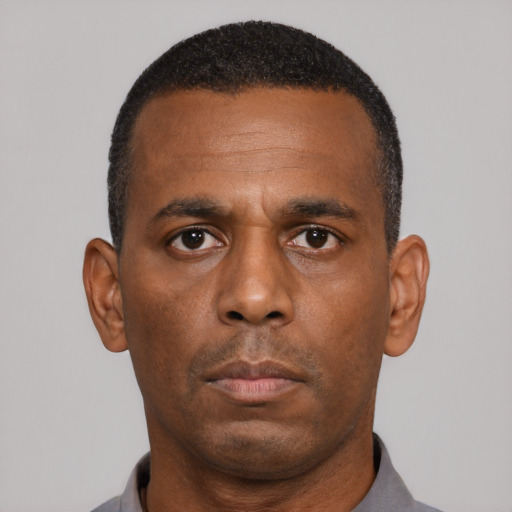 Neutral black adult male with short  black hair and brown eyes