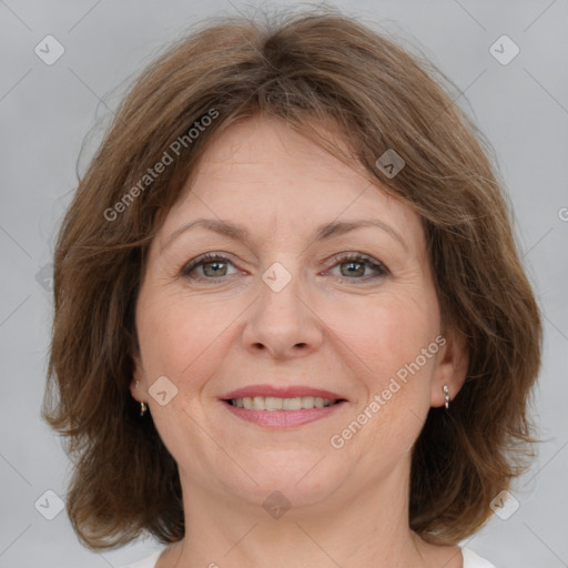 Joyful white adult female with medium  brown hair and brown eyes