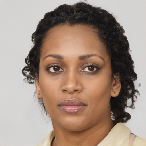 Neutral black young-adult female with medium  black hair and brown eyes