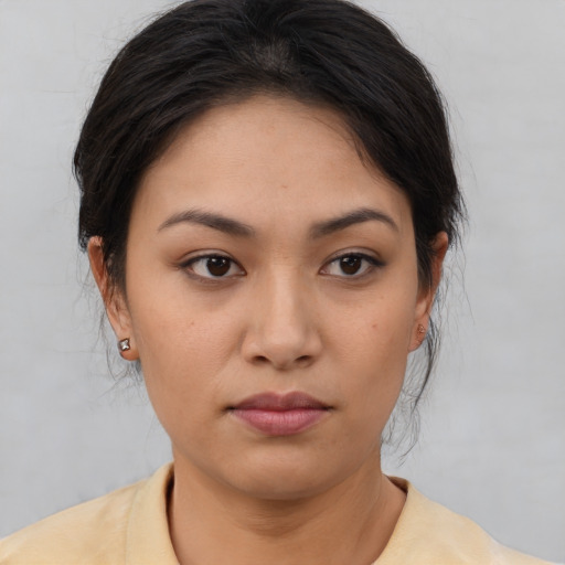 Neutral asian young-adult female with medium  brown hair and brown eyes