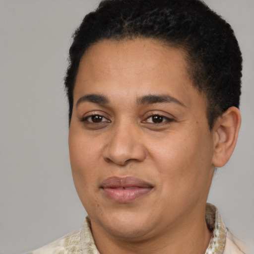 Joyful latino adult female with short  brown hair and brown eyes