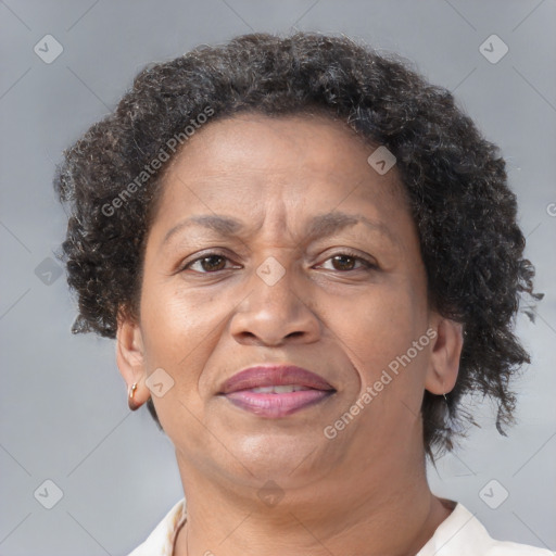 Joyful black adult female with short  brown hair and brown eyes