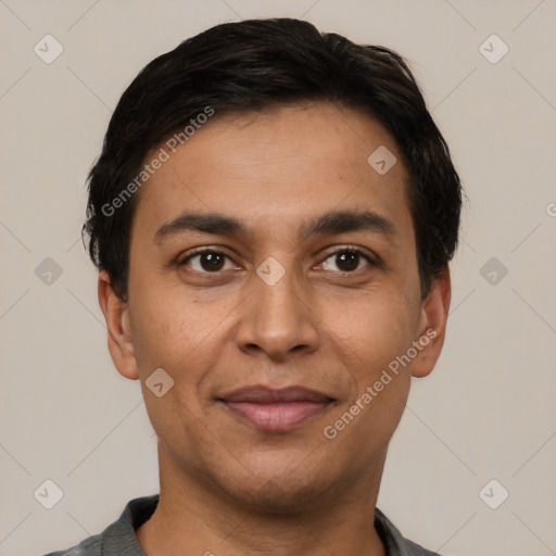 Joyful white young-adult male with short  black hair and brown eyes