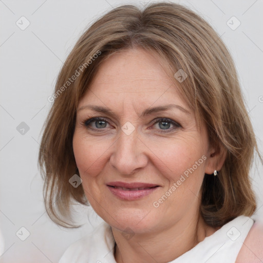 Joyful white adult female with medium  brown hair and brown eyes