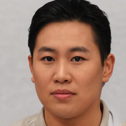 Neutral asian young-adult male with short  brown hair and brown eyes