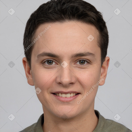 Joyful white young-adult male with short  brown hair and grey eyes