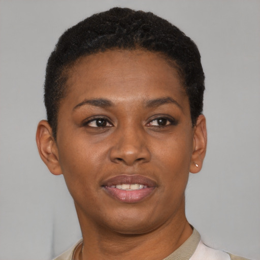 Joyful black young-adult female with short  brown hair and brown eyes
