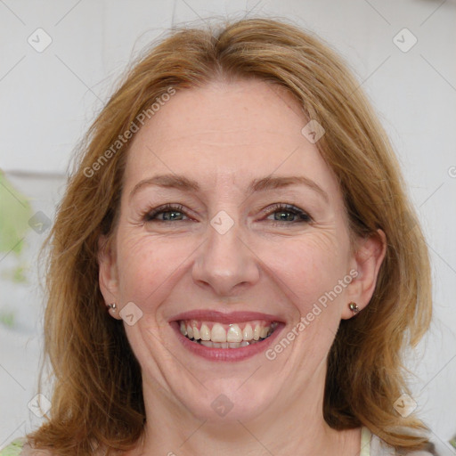 Joyful white adult female with medium  brown hair and blue eyes