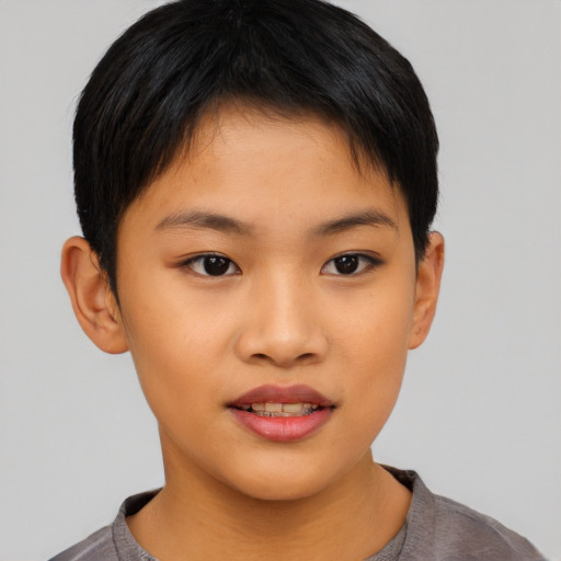 Joyful asian child female with short  brown hair and brown eyes