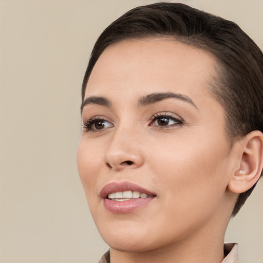 Joyful white young-adult female with short  brown hair and brown eyes