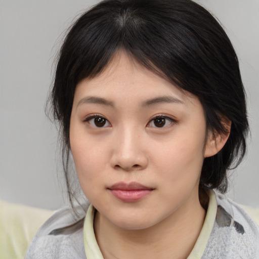 Neutral asian young-adult female with medium  brown hair and brown eyes