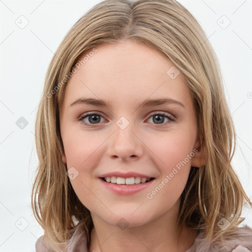 Joyful white child female with medium  brown hair and brown eyes