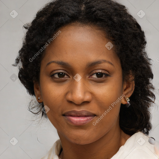 Joyful black young-adult female with long  brown hair and brown eyes