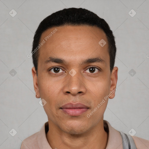 Joyful black young-adult male with short  black hair and brown eyes