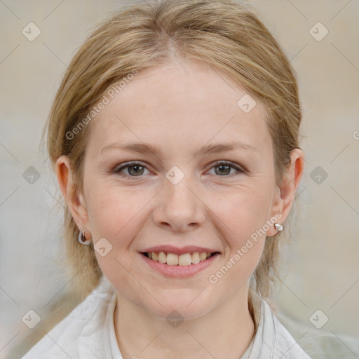 Joyful white young-adult female with medium  brown hair and blue eyes