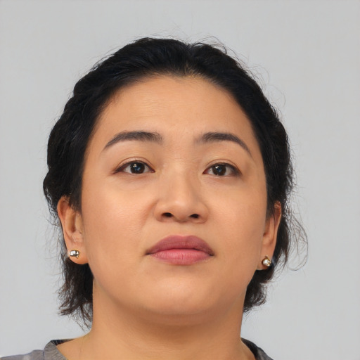 Neutral asian young-adult female with medium  brown hair and brown eyes
