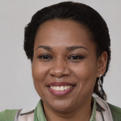 Joyful latino adult female with short  brown hair and brown eyes
