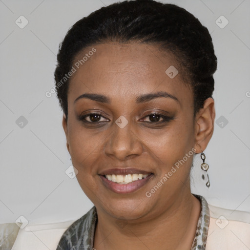 Joyful black young-adult female with short  black hair and brown eyes
