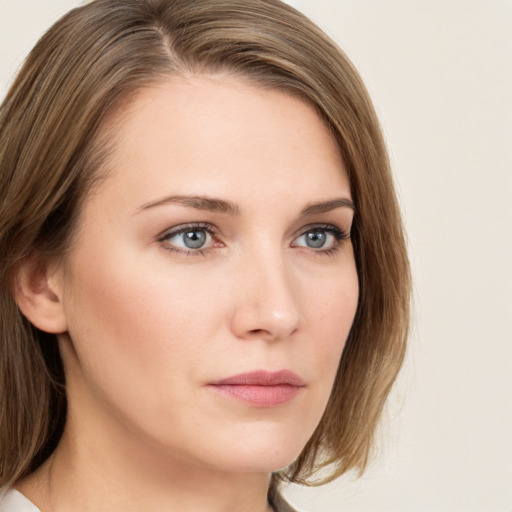 Neutral white young-adult female with medium  brown hair and grey eyes