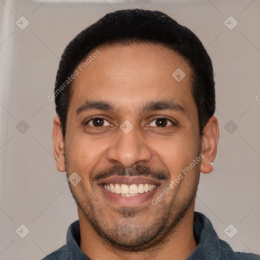 Joyful latino young-adult male with short  black hair and brown eyes