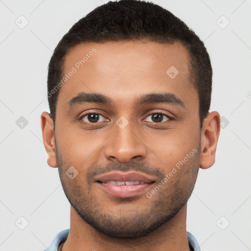 Joyful black young-adult male with short  brown hair and brown eyes