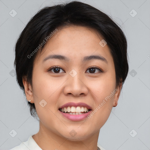 Joyful asian young-adult female with short  brown hair and brown eyes