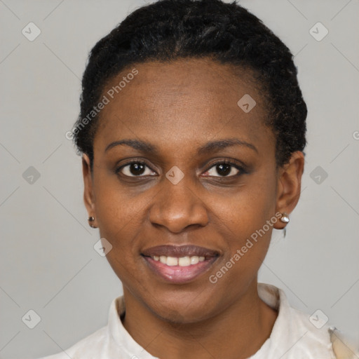 Joyful black young-adult female with short  black hair and brown eyes