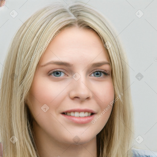 Joyful white young-adult female with long  brown hair and blue eyes