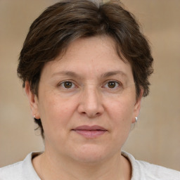 Joyful white adult female with short  brown hair and brown eyes