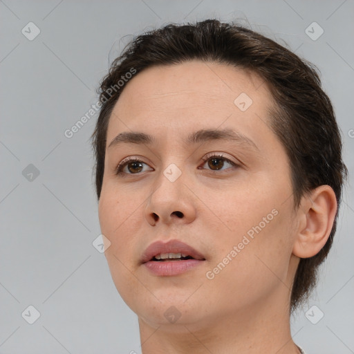 Joyful white young-adult female with medium  brown hair and brown eyes