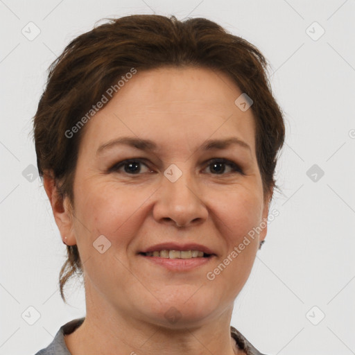 Joyful white adult female with short  brown hair and brown eyes