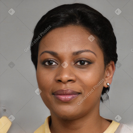 Joyful black young-adult female with short  black hair and brown eyes
