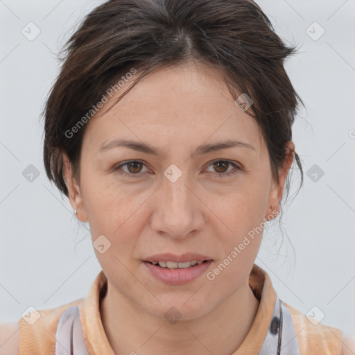 Joyful white adult female with medium  brown hair and brown eyes