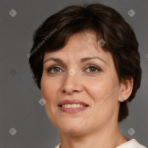 Joyful white adult female with short  brown hair and brown eyes