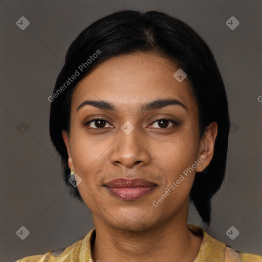 Joyful black young-adult female with short  black hair and brown eyes