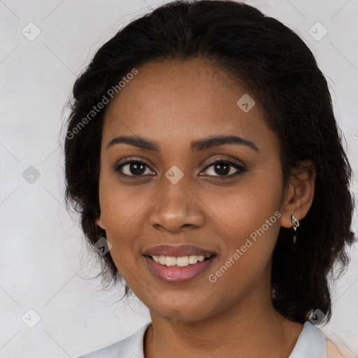 Joyful black young-adult female with long  brown hair and brown eyes