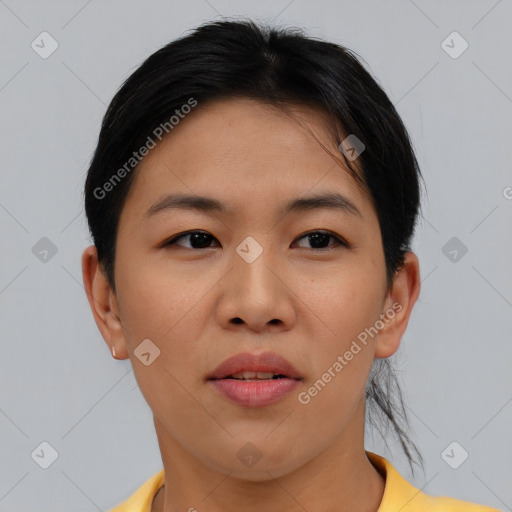 Joyful asian young-adult female with short  black hair and brown eyes