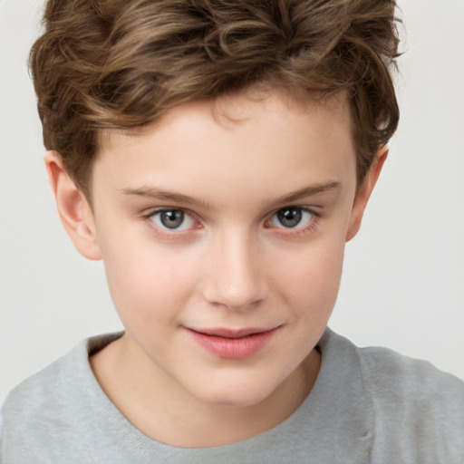 Joyful white child male with short  brown hair and brown eyes