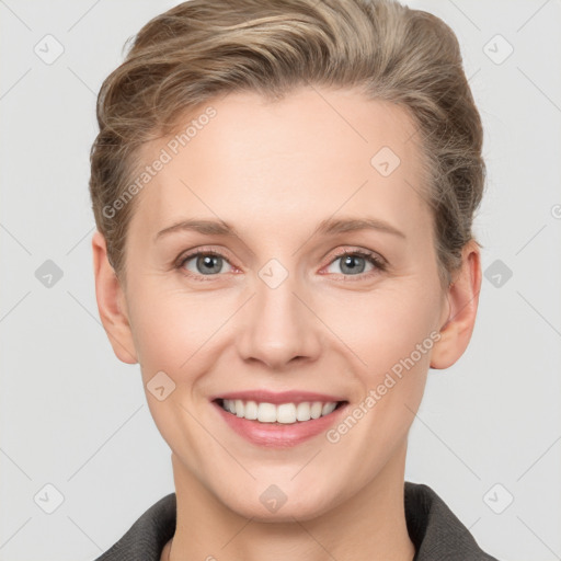 Joyful white young-adult female with short  brown hair and grey eyes