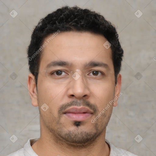 Neutral white young-adult male with short  black hair and brown eyes