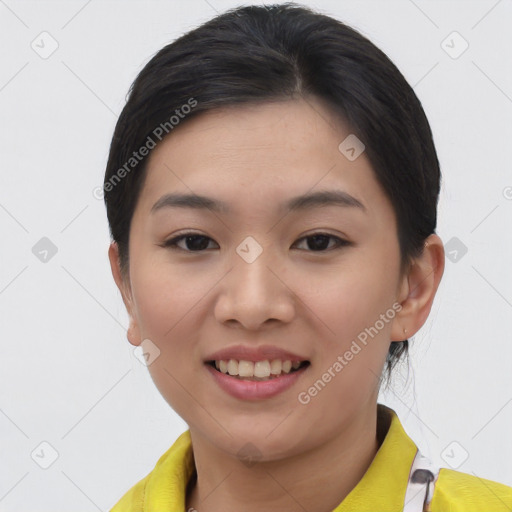 Joyful asian young-adult female with short  brown hair and brown eyes