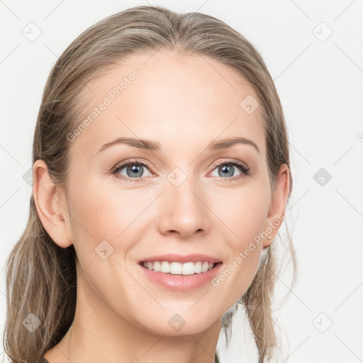 Joyful white young-adult female with long  brown hair and blue eyes