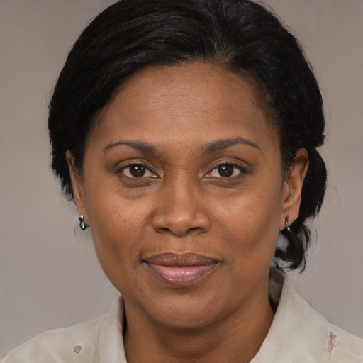 Joyful asian adult female with medium  brown hair and brown eyes