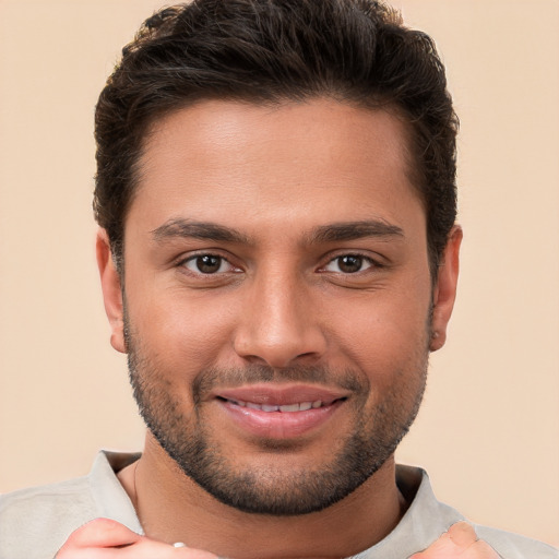 Joyful white young-adult male with short  brown hair and brown eyes