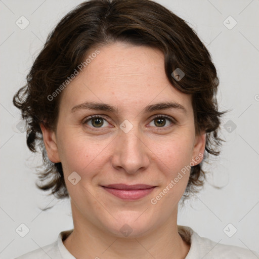 Joyful white young-adult female with medium  brown hair and green eyes