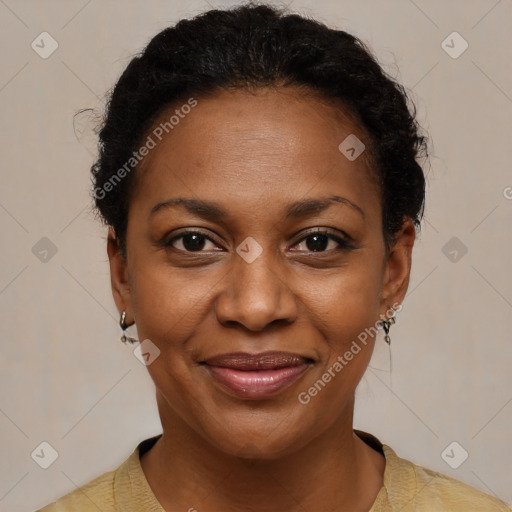 Joyful black adult female with short  brown hair and brown eyes