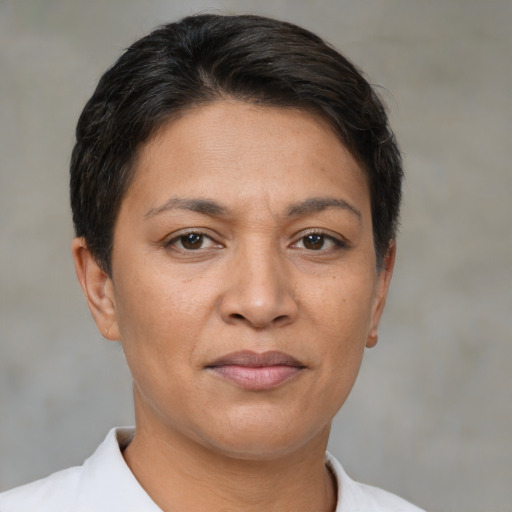 Joyful white adult female with short  brown hair and brown eyes