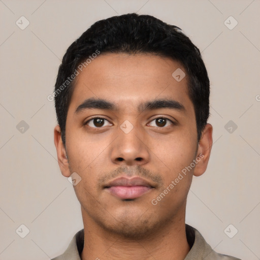 Neutral latino young-adult male with short  black hair and brown eyes