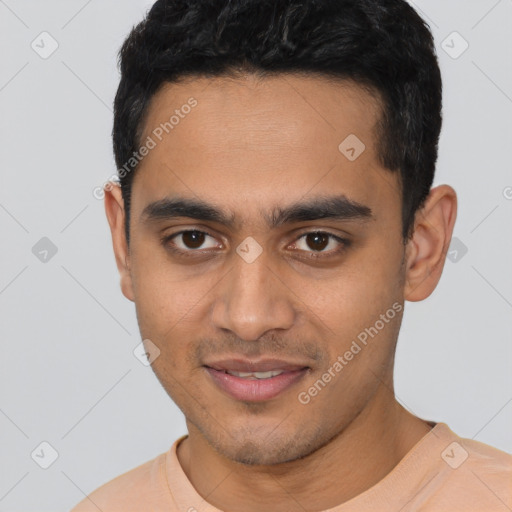 Joyful latino young-adult male with short  black hair and brown eyes