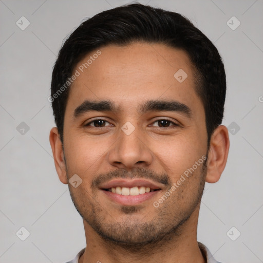 Joyful latino young-adult male with short  black hair and brown eyes